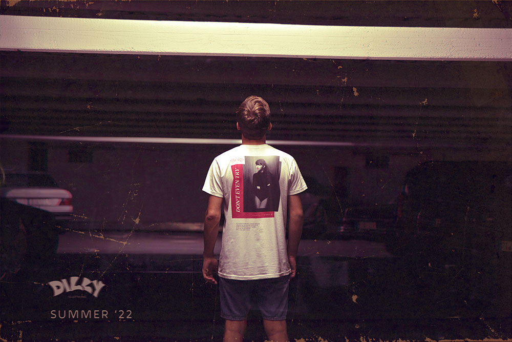 model standing backwards in parking garage